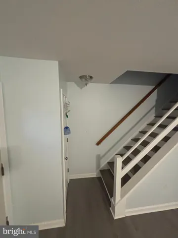 a view of a hallway with staircase