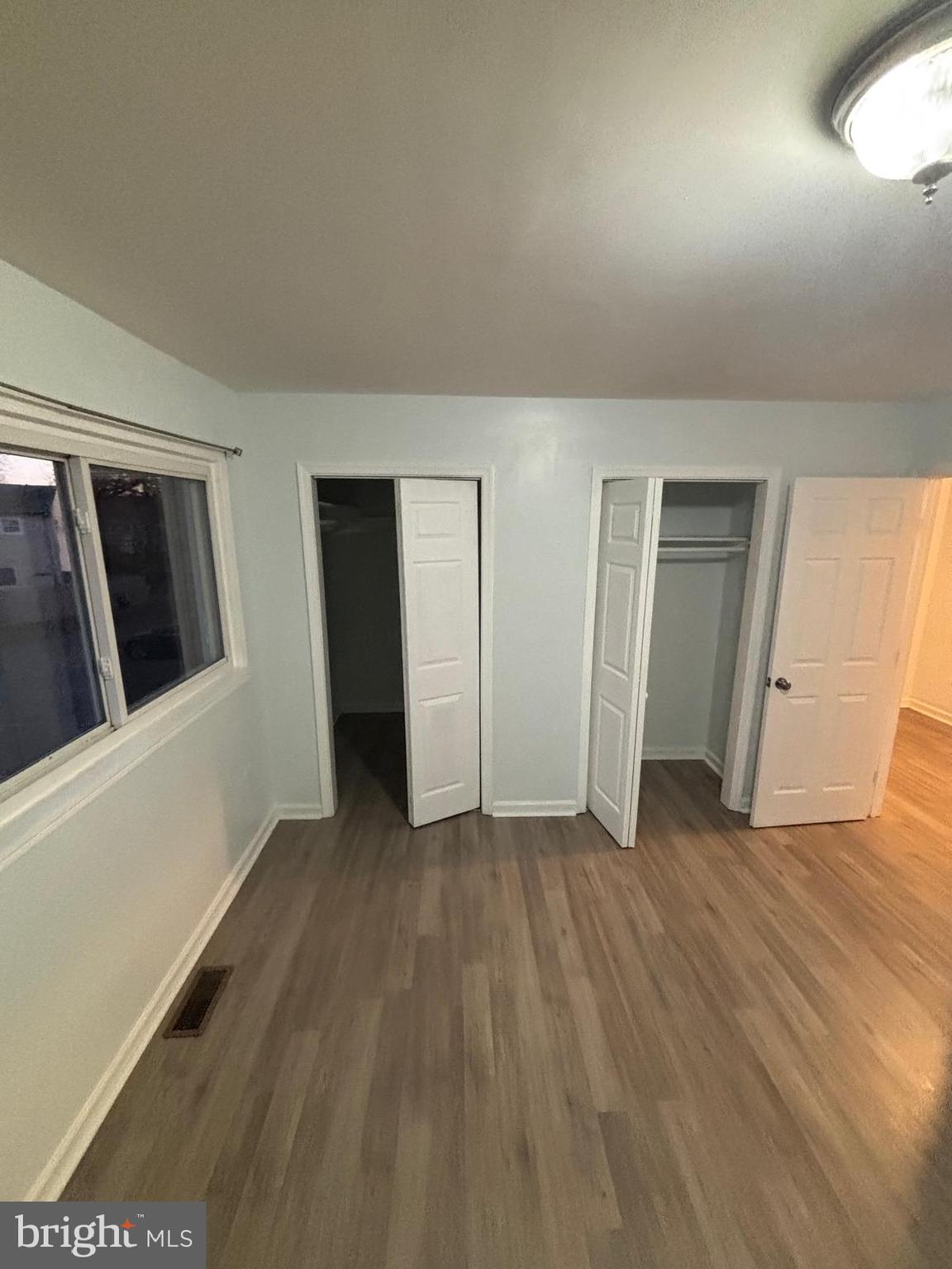 926 Anvil Road Fredericksburg, VA 22405 - Photo 7 of 11 wooden floor in an empty room with a window