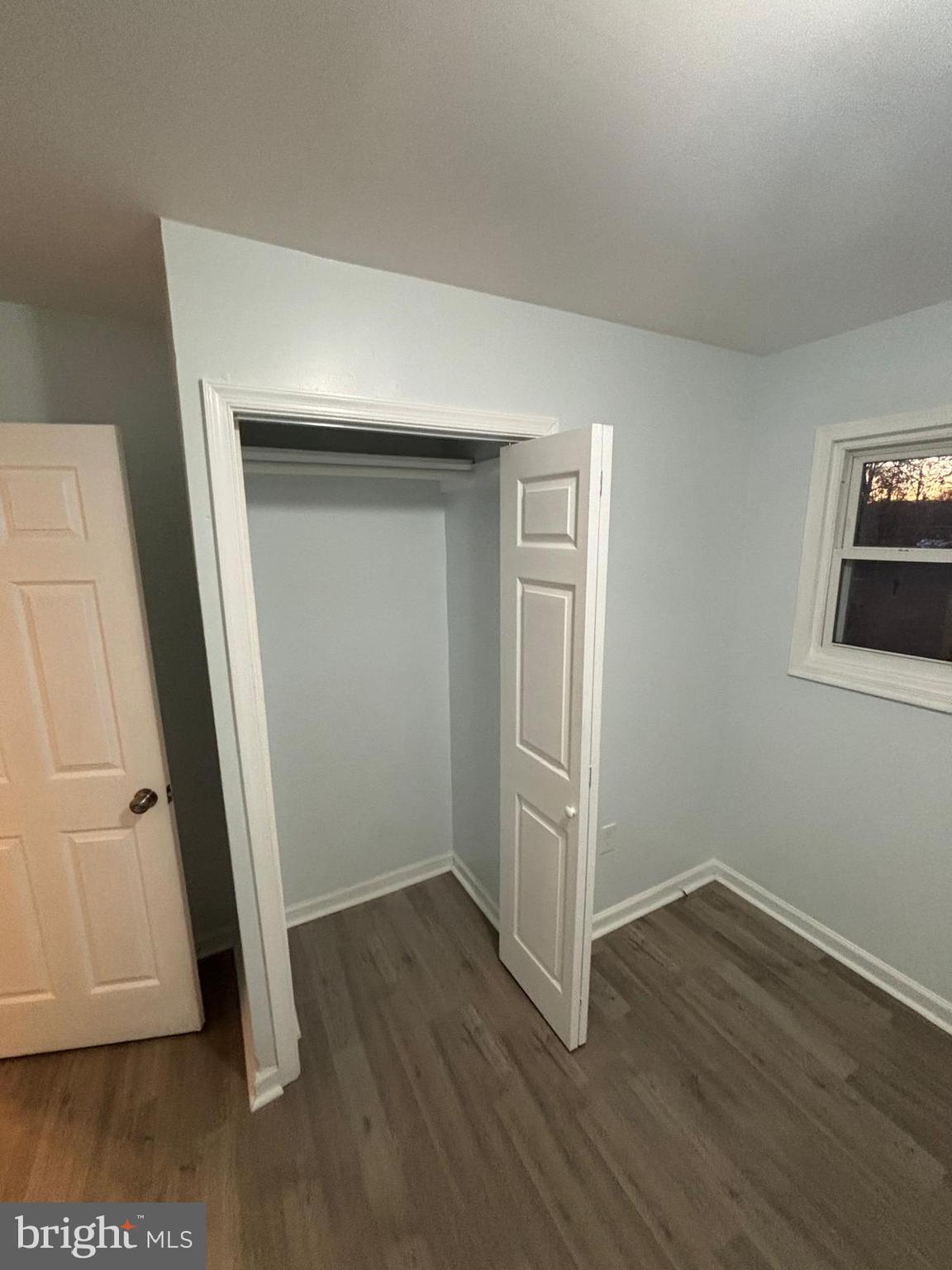 926 Anvil Road Fredericksburg, VA 22405 - Photo 10 of 11 an empty room with wooden floor and closet