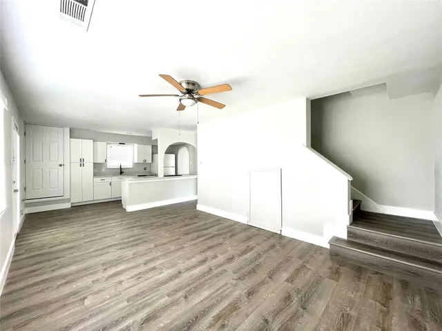 a view of a kitchen with a sink and a cabinet