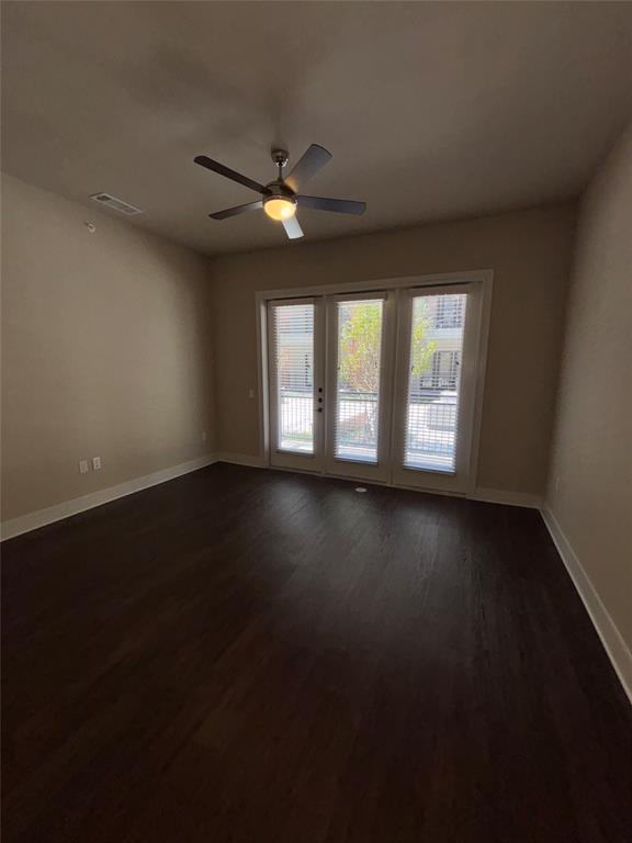 111 Town Place, Unit 2290 Fairview, TX 75069 - Photo 5 of 30 a view of an empty room with wooden floor and a window