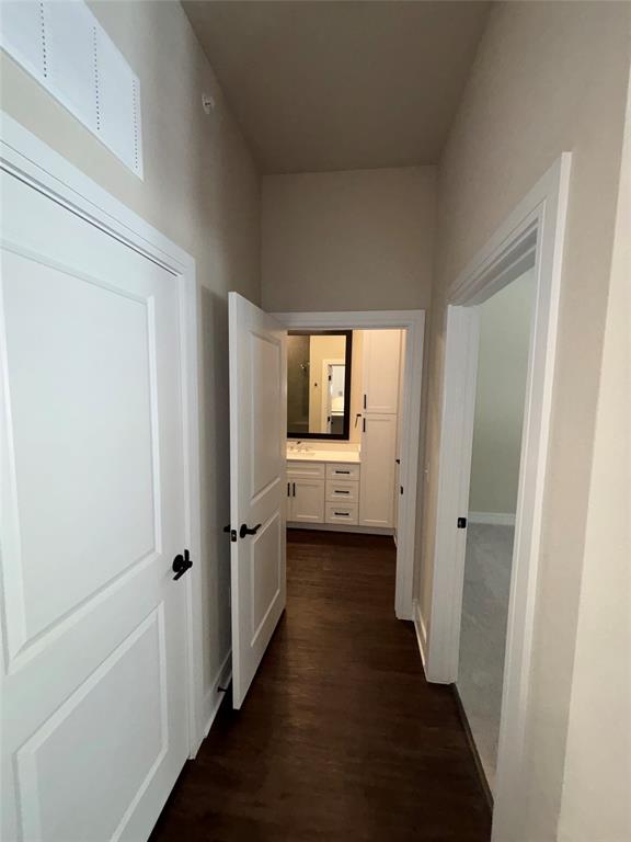 111 Town Place, Unit 2290 Fairview, TX 75069 - Photo 7 of 30 a view of a hallway with wooden floor and closet