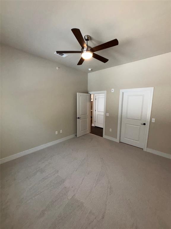 111 Town Place, Unit 2290 Fairview, TX 75069 - Photo 8 of 30 an empty room with chandelier fan