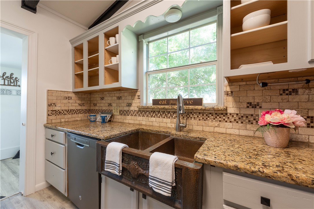 132 Zenna Drive Mathis, TX 78368 - Photo 4 of 40 a kitchen with a sink cabinets and window