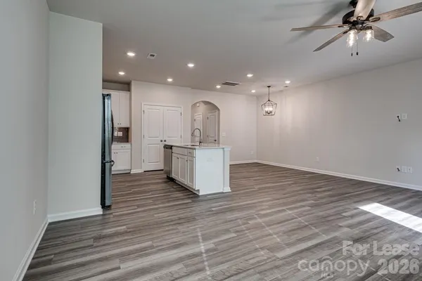 a view of a kitchen with a sink and cabinets