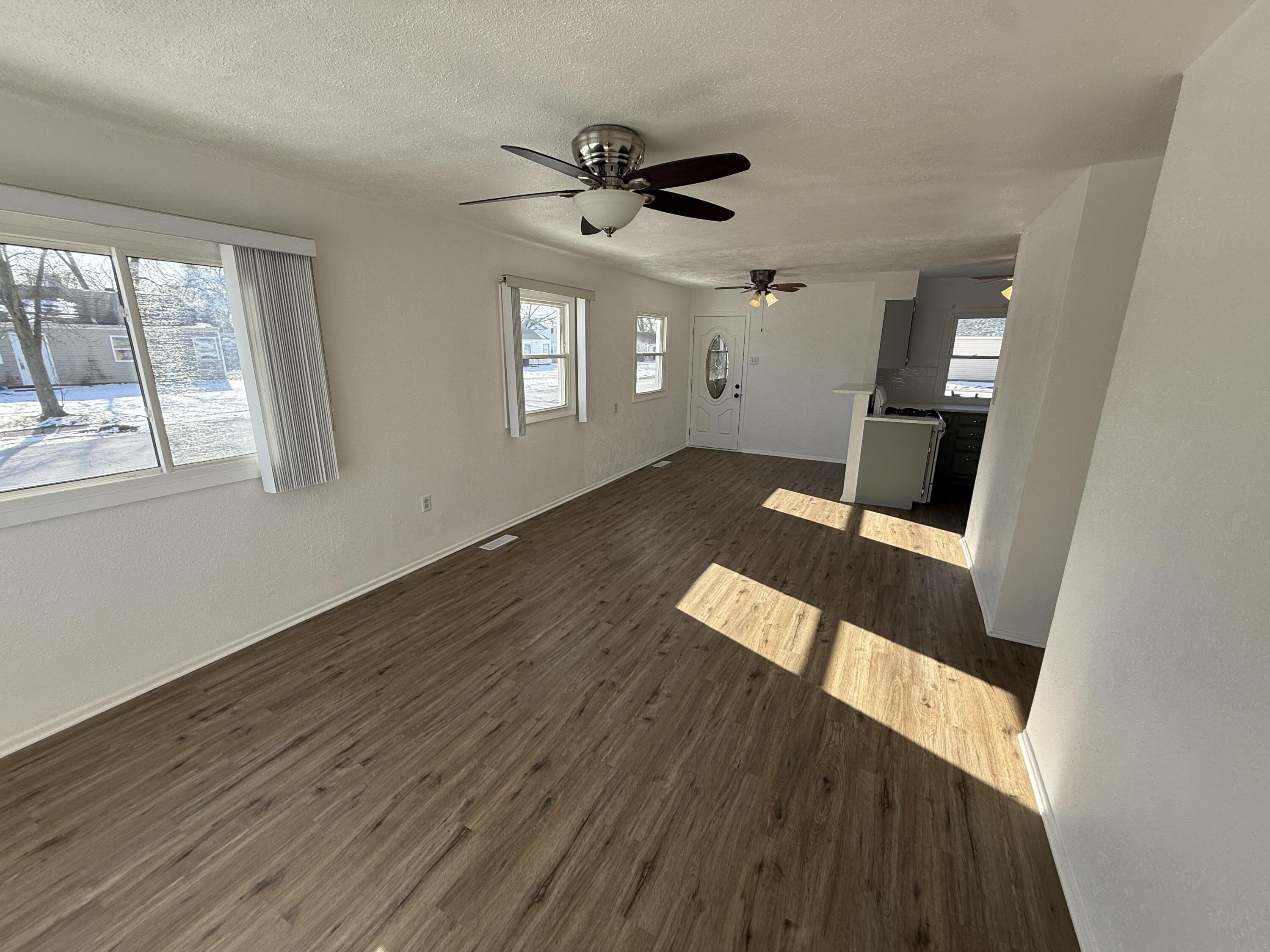 400 North Virginia Street Hobart, IN 46342 - Photo 4 of 13 wooden floor in an empty room with a window