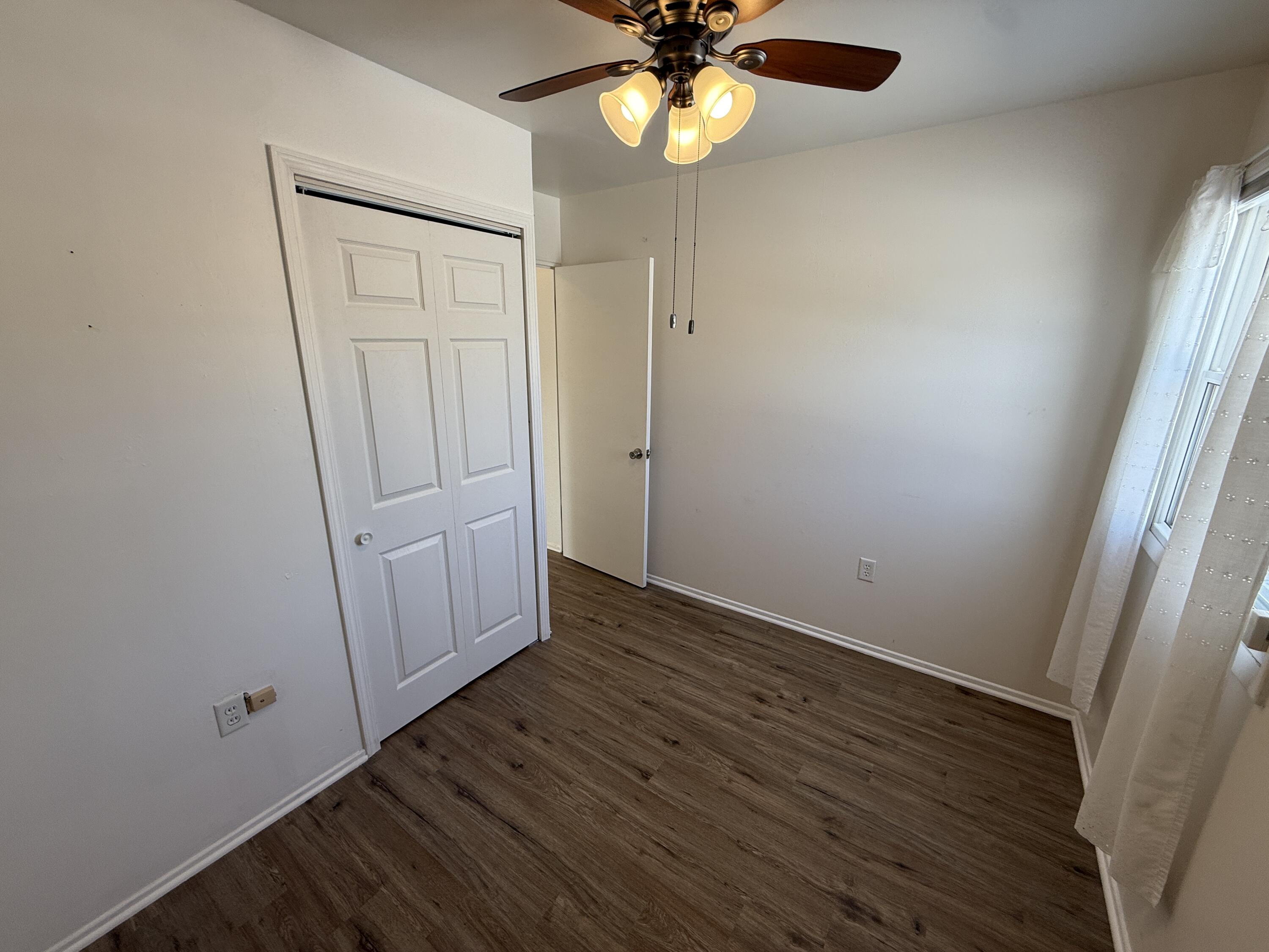 400 North Virginia Street Hobart, IN 46342 - Photo 9 of 13 an empty room with wooden floor and windows