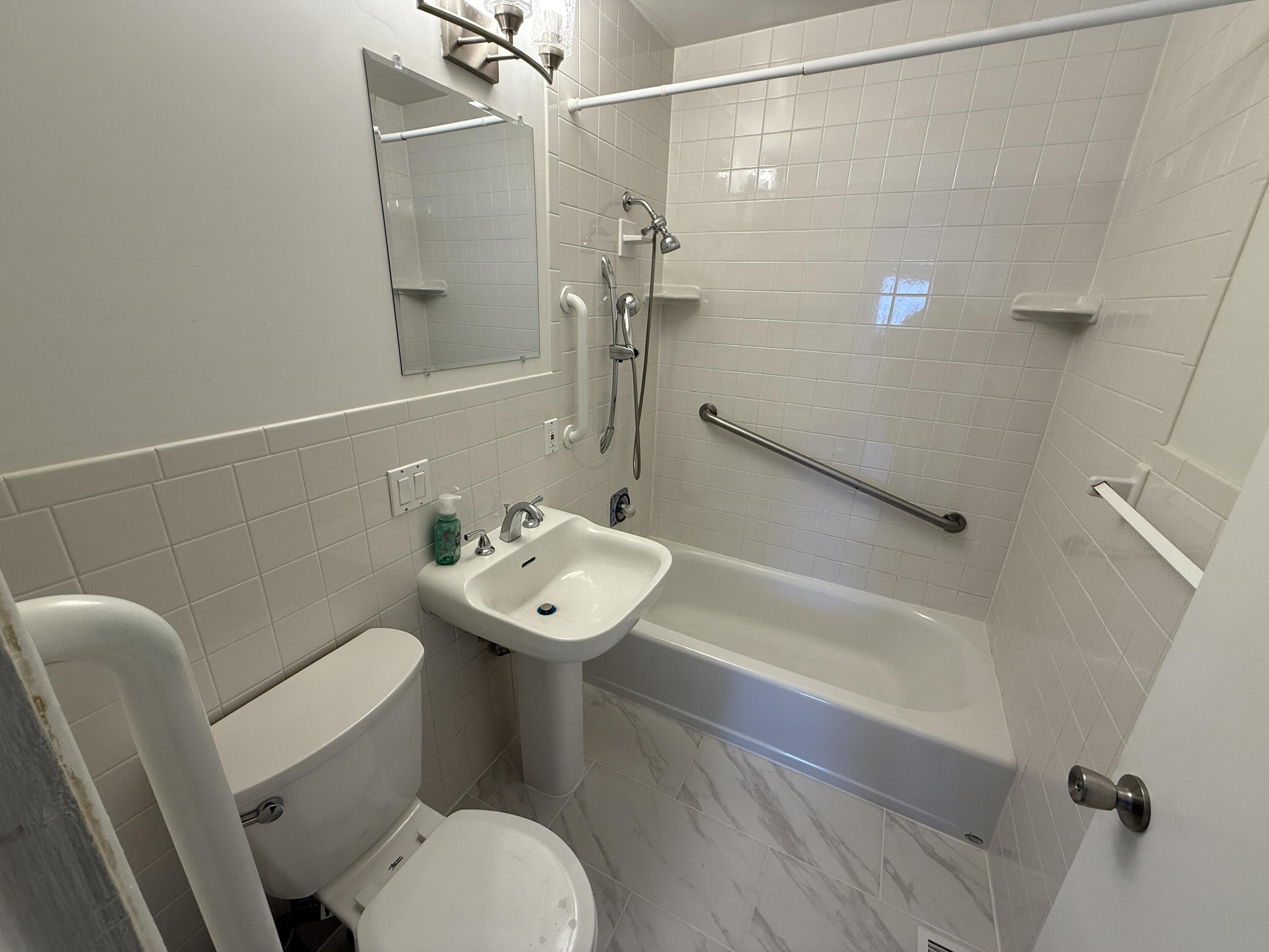 400 North Virginia Street Hobart, IN 46342 - Photo 10 of 13 a bathroom with a sink a toilet and shower