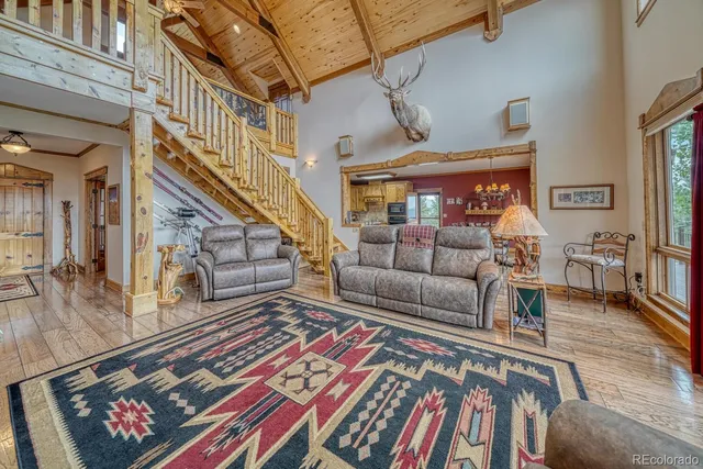 a living room with furniture and a rug