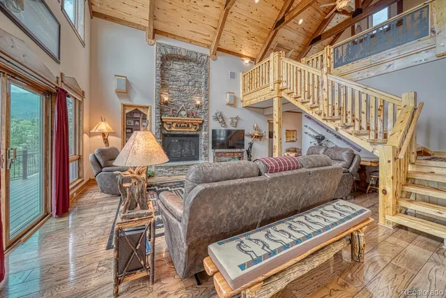 a living room with furniture a rug and white walls