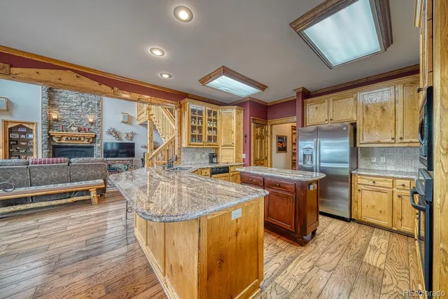 a kitchen with a stove sink and cabinets