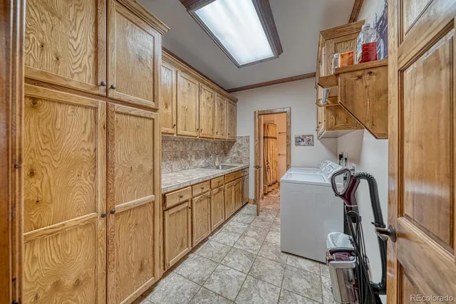 a bathroom with a sink vanity granite and toilet