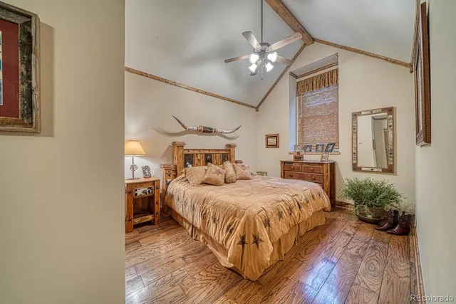 a bathroom with a granite countertop sink a mirror a shower and vanity