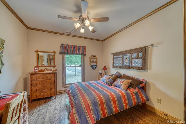 a view of hallway with stairs and wooden floor