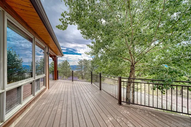 a view of balcony with wooden floor