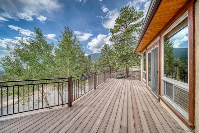 a bed room with furniture and wooden floor