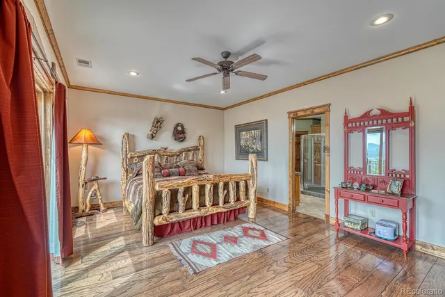 a bathroom with a granite countertop sink a large mirror and a shower