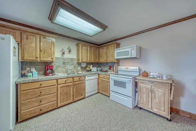 a bedroom with a large bed and a large window