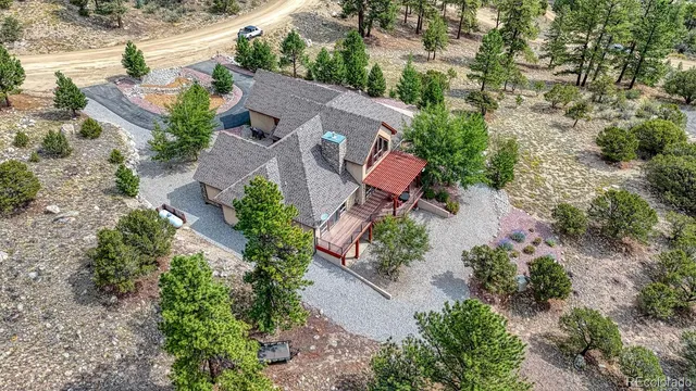 an aerial view of house with yard