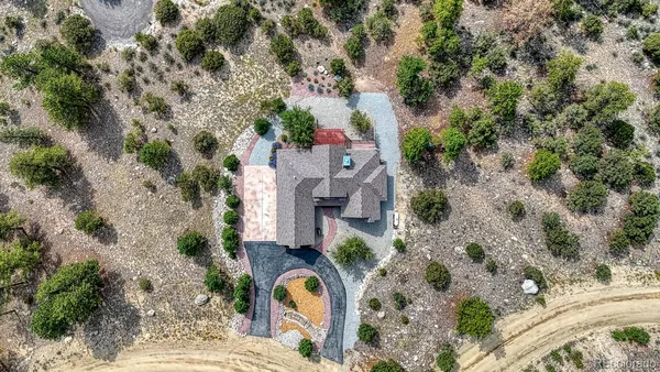 an aerial view of a house with outdoor space