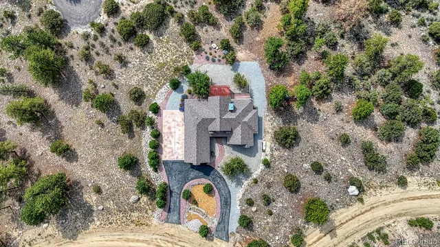 an aerial view of a house with outdoor space
