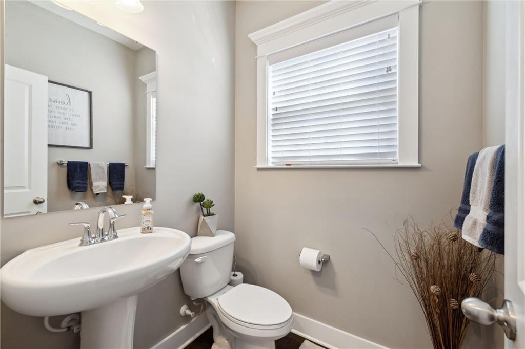 212 Stoneridge Lane Mars, PA 16046 - Photo 21 of 50 a bathroom with a sink a mirror and a toilet