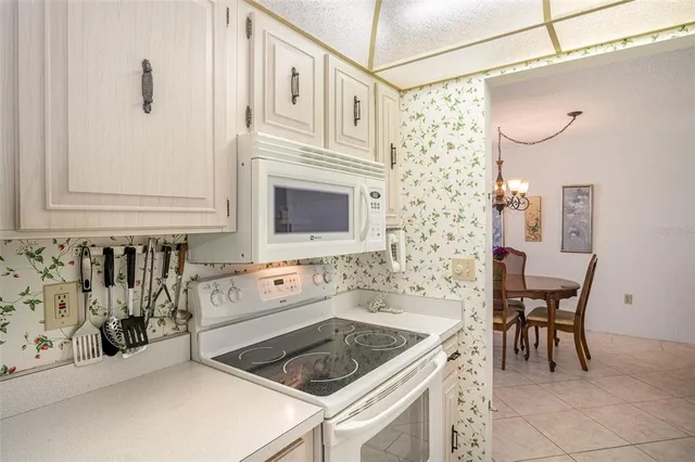 a kitchen that has a sink and a stove