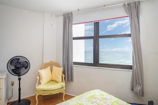 a view of workspace with furniture and window