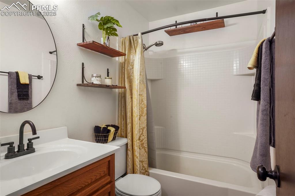 2417 Ranch Lane Colorado Springs, CO 80918 - Photo 11 of 32 a bathroom with a sink toilet and shower