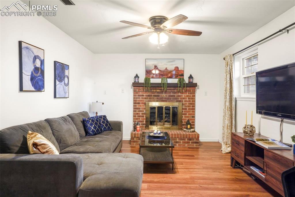 2417 Ranch Lane Colorado Springs, CO 80918 - Photo 15 of 32 a living room with furniture fireplace and flat screen tv