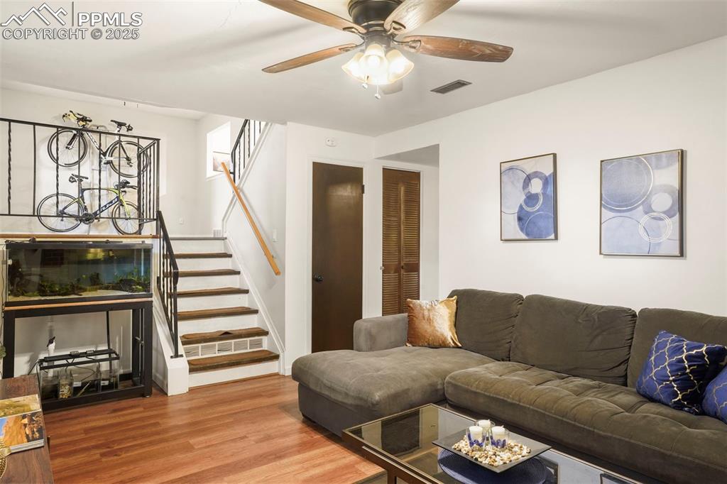 2417 Ranch Lane Colorado Springs, CO 80918 - Photo 16 of 32 a living room with furniture and wooden floor