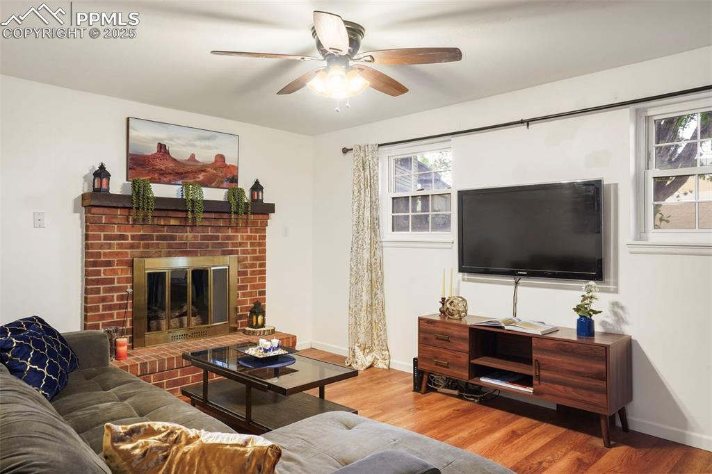 2417 Ranch Lane Colorado Springs, CO 80918 - Photo 17 of 32 a living room with furniture and a flat screen tv