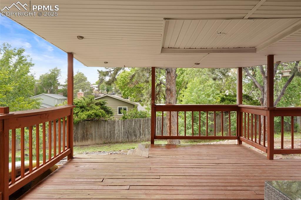 2417 Ranch Lane Colorado Springs, CO 80918 - Photo 21 of 32 a view of deck with wooden floor and outdoor space