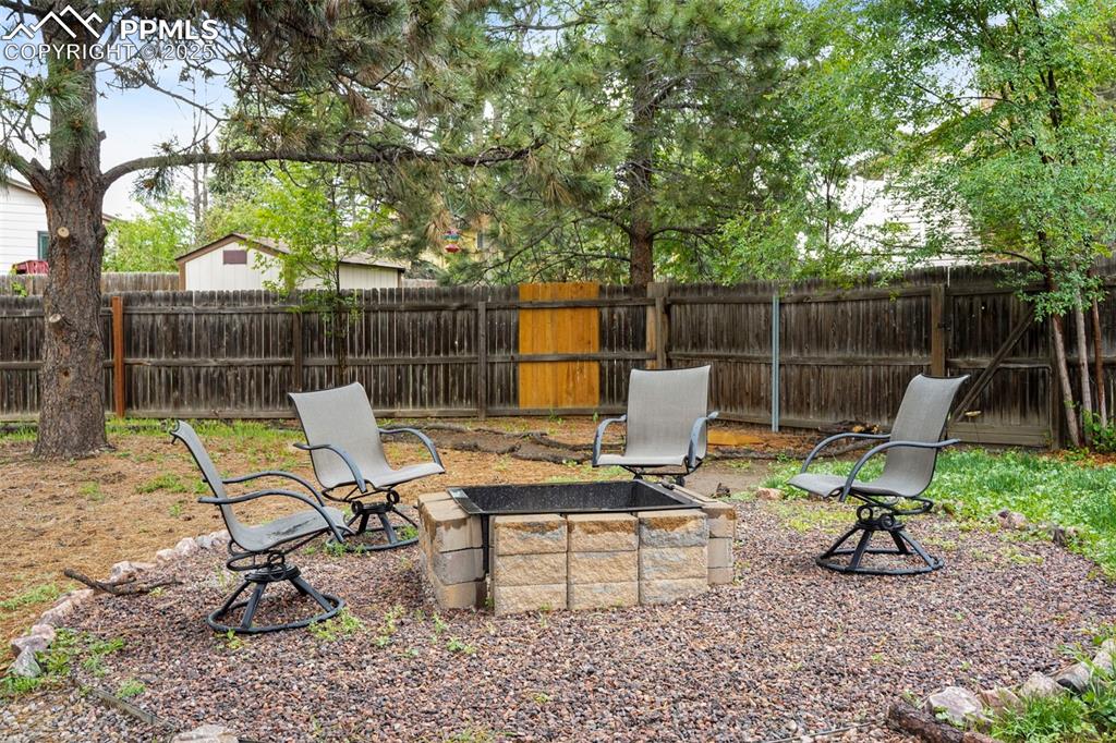 2417 Ranch Lane Colorado Springs, CO 80918 - Photo 23 of 32 a view of a lounge chair and chairs in the patio