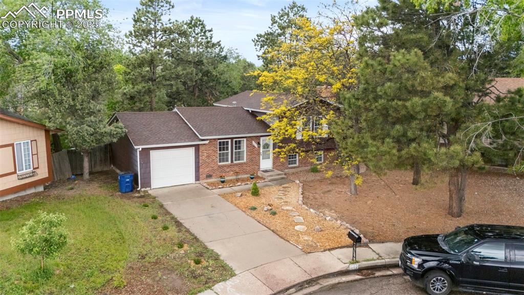 2417 Ranch Lane Colorado Springs, CO 80918 - Photo 28 of 32 a view of a house with a patio