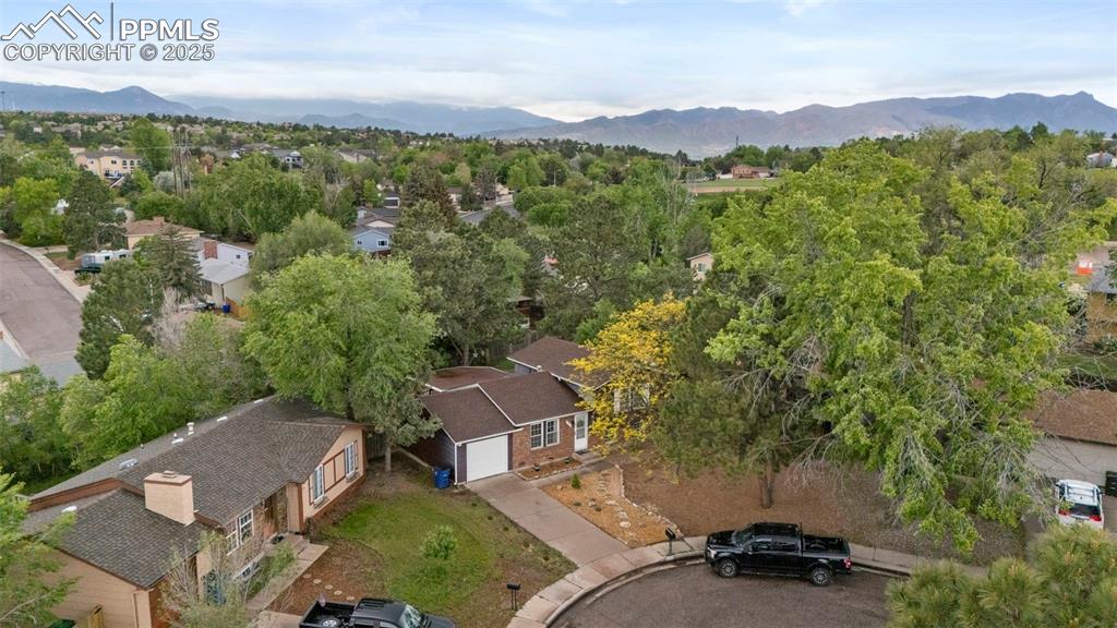 2417 Ranch Lane Colorado Springs, CO 80918 - Photo 29 of 32 an aerial view of a house with mountain view