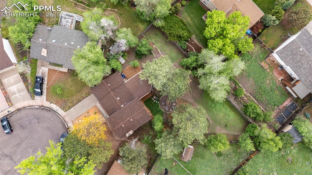 2417 Ranch Lane Colorado Springs, CO 80918 - Photo 30 of 32 an aerial view of a house with garden space and street view