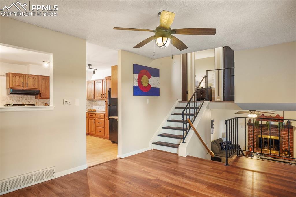 2417 Ranch Lane Colorado Springs, CO 80918 - Photo 5 of 32 a view of entryway and hall with wooden floor