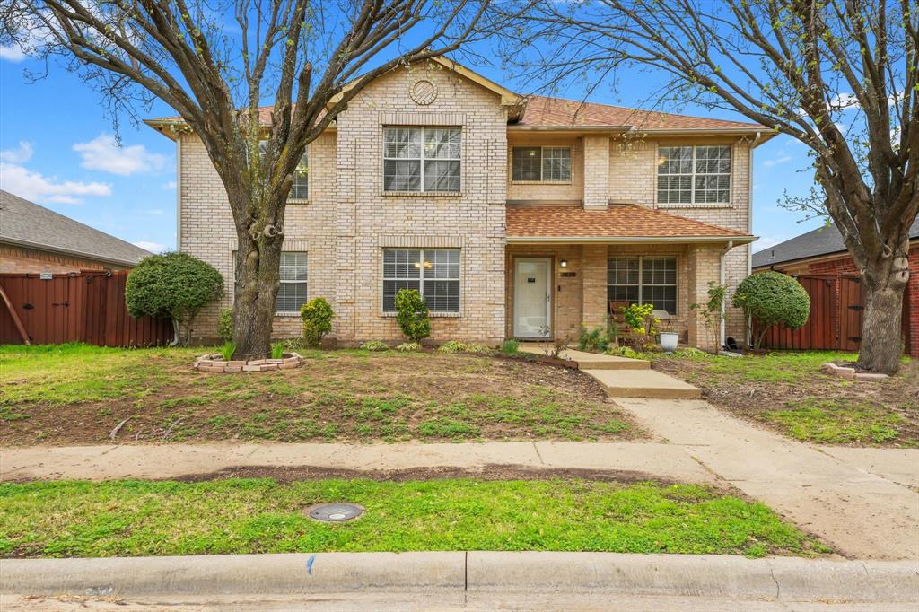 1818 Cedar Ridge Drive Mesquite, TX 75181 - Photo 1 of 21 Traditional-style home with brick siding, a porch, and a gate