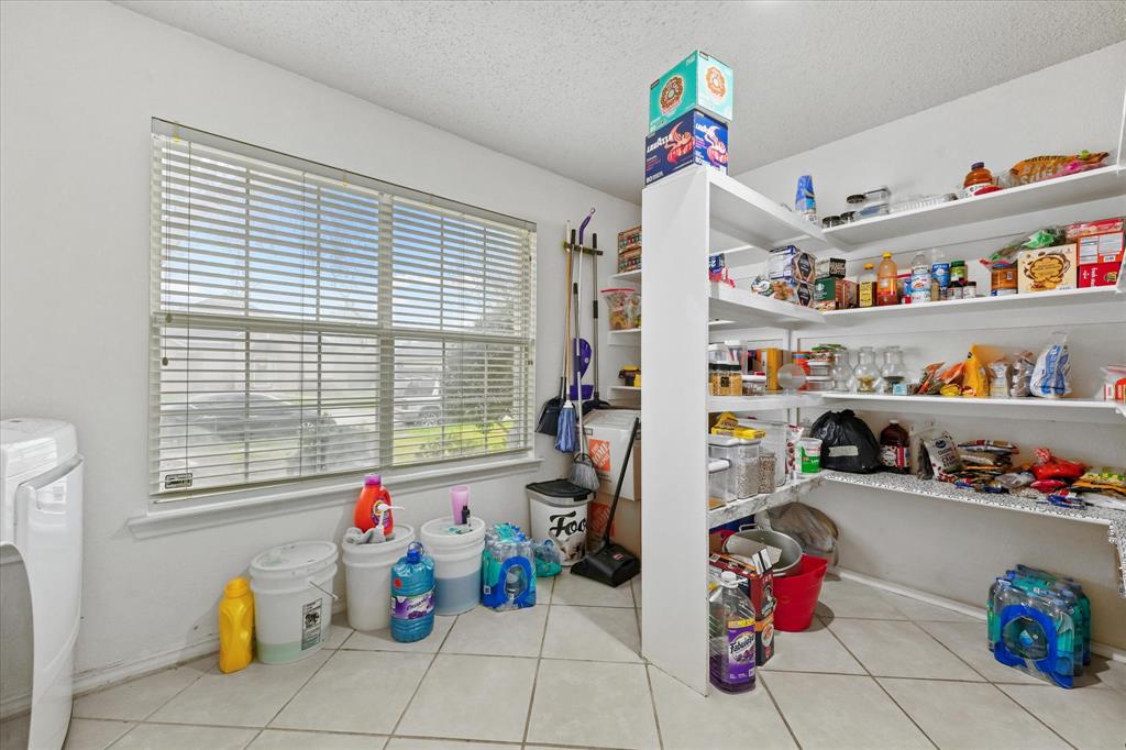 1818 Cedar Ridge Drive Mesquite, TX 75181 - Photo 11 of 21 Storage area with washer / dryer