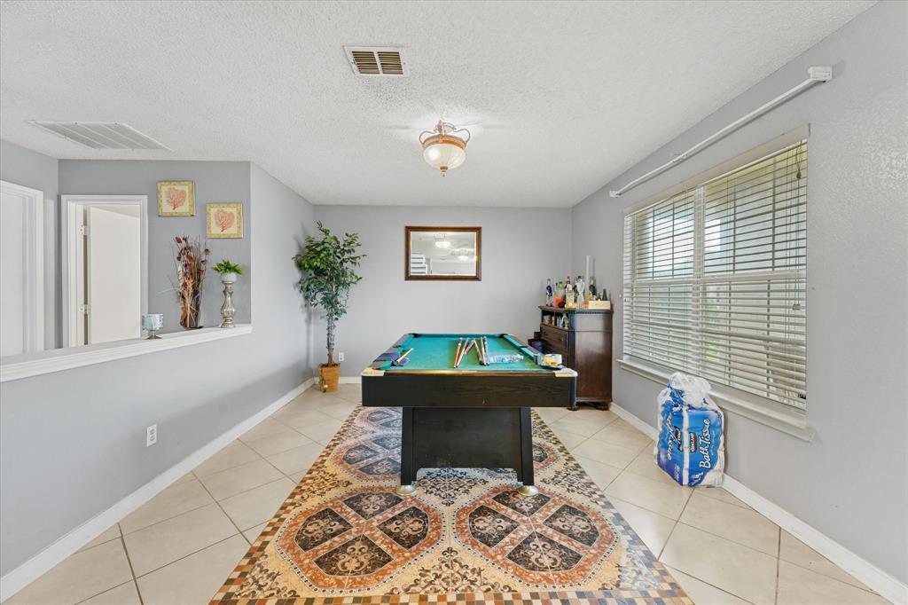 1818 Cedar Ridge Drive Mesquite, TX 75181 - Photo 12 of 21 Rec room with billiards table, a textured ceiling, and light tile patterned floors