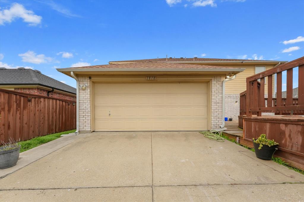 1818 Cedar Ridge Drive Mesquite, TX 75181 - Photo 20 of 21 Garage featuring driveway