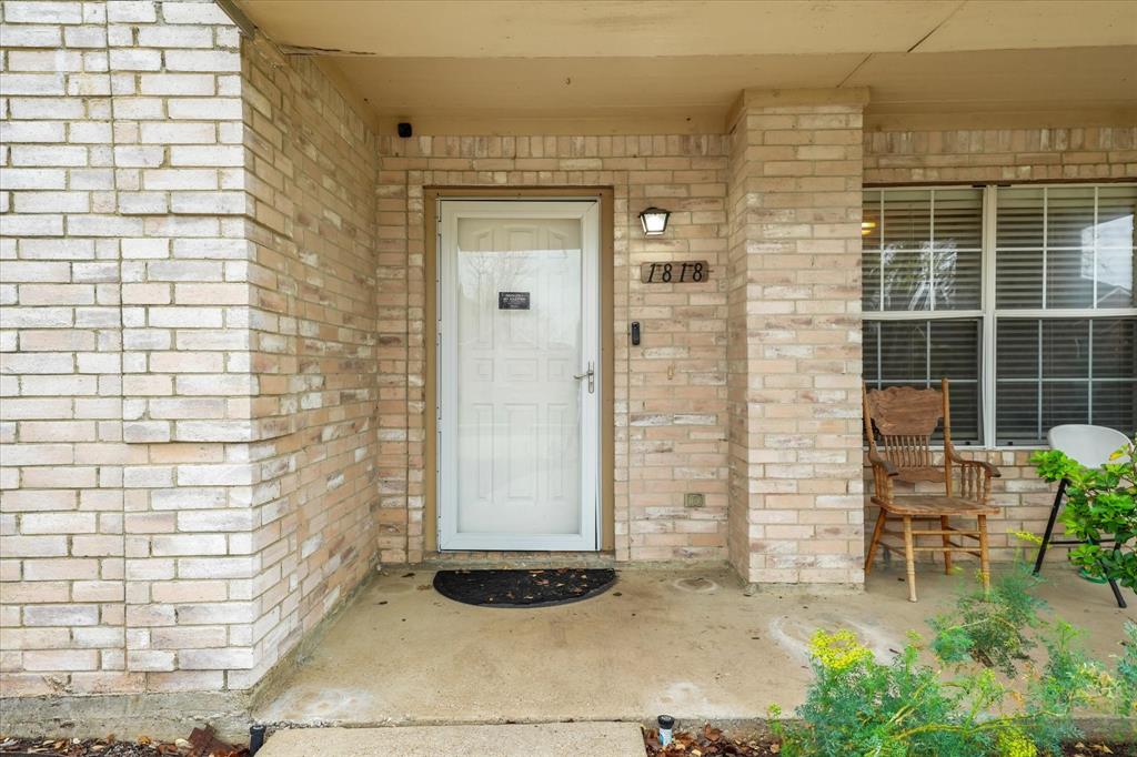 1818 Cedar Ridge Drive Mesquite, TX 75181 - Photo 3 of 21 Doorway to property with brick siding and covered porch