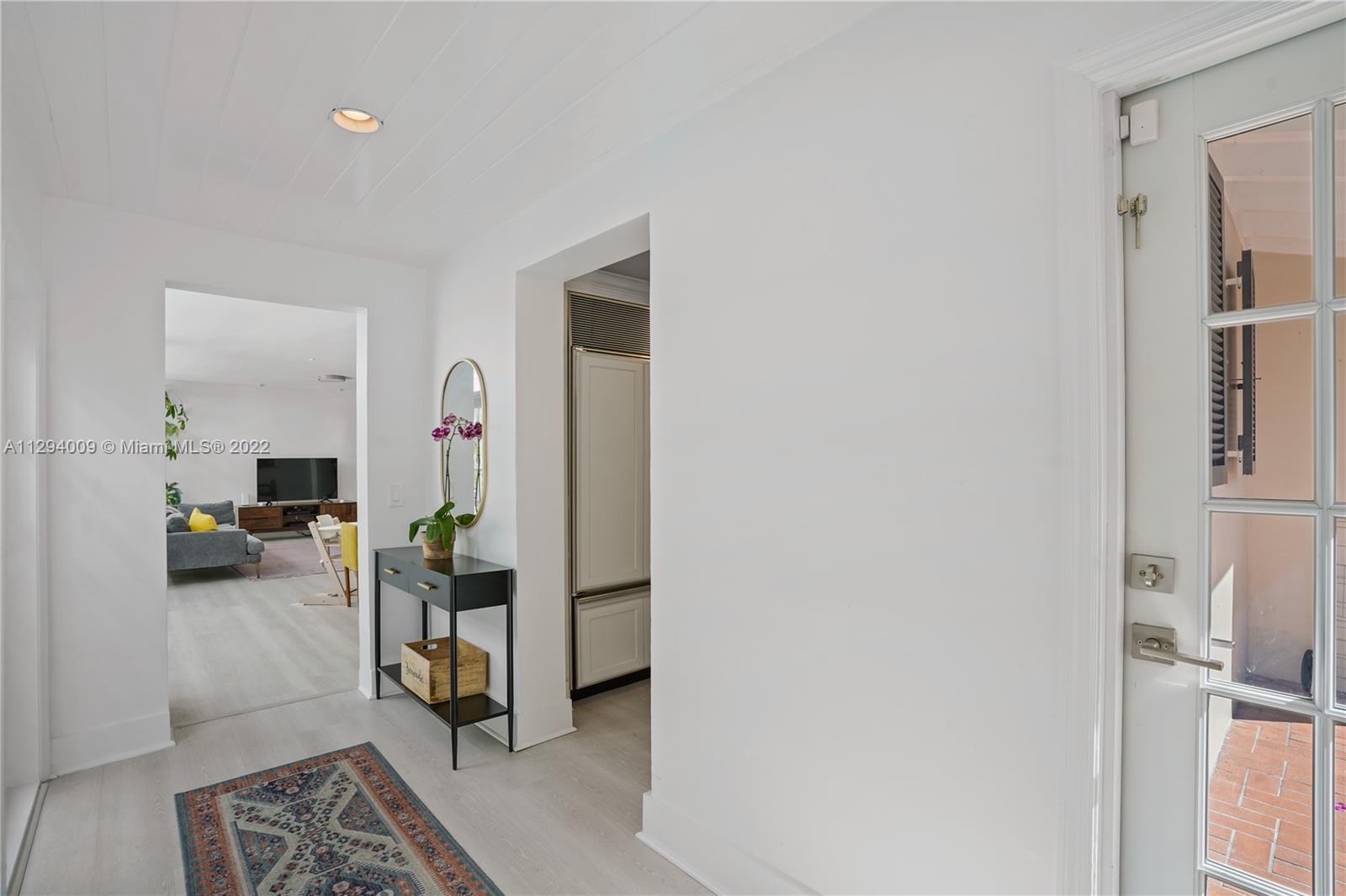 1701 Micanopy Avenue Miami, FL 33133 - Photo 13 of 46 a livingroom with furniture and a rug