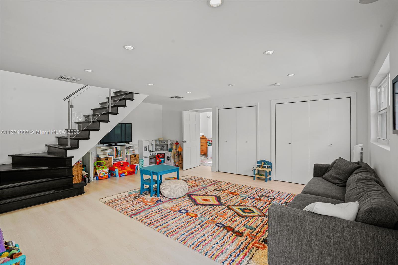 1701 Micanopy Avenue Miami, FL 33133 - Photo 17 of 46 a bedroom with furniture and stairs