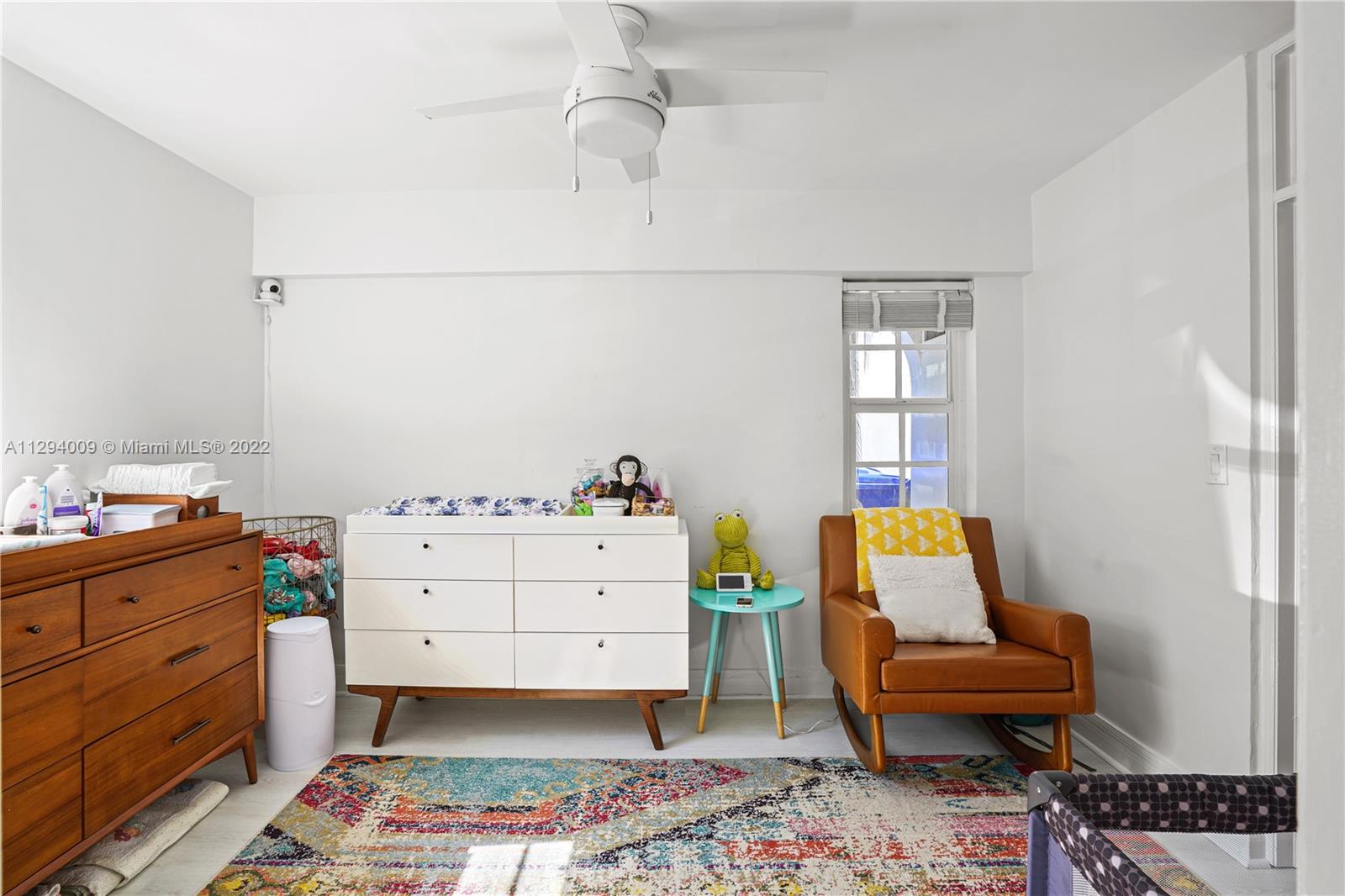 1701 Micanopy Avenue Miami, FL 33133 - Photo 18 of 46 a bed room with a bed and a chair