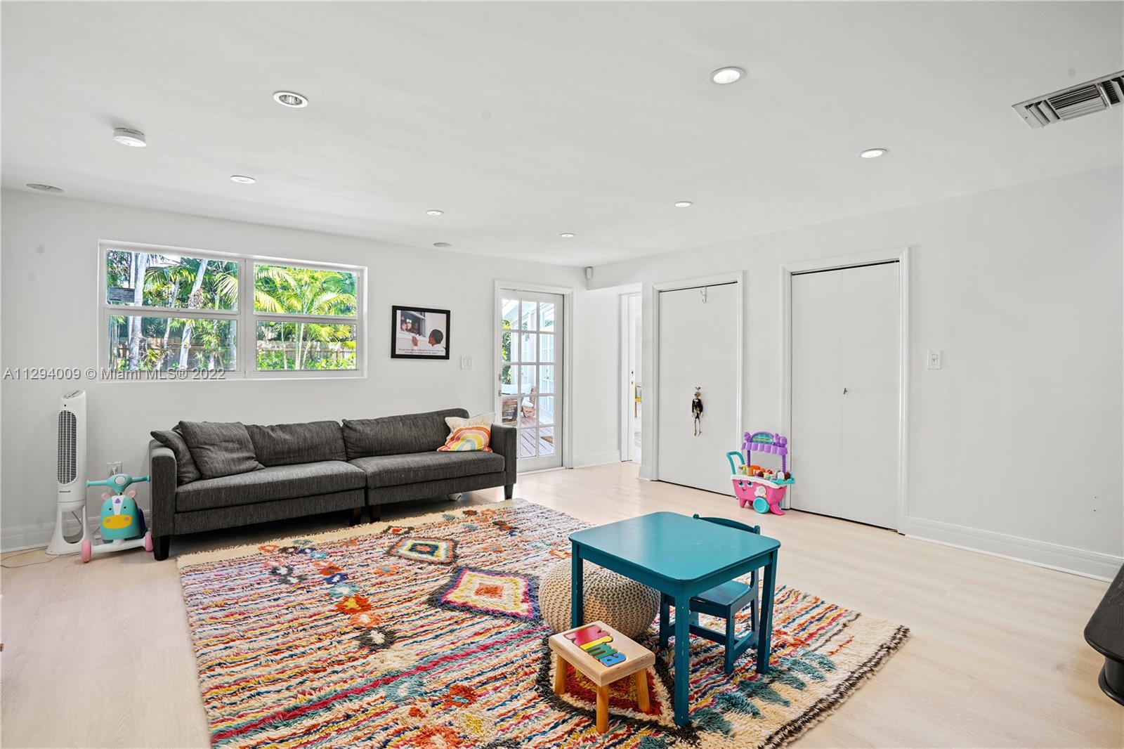 1701 Micanopy Avenue Miami, FL 33133 - Photo 19 of 46 a living room with furniture and a large window