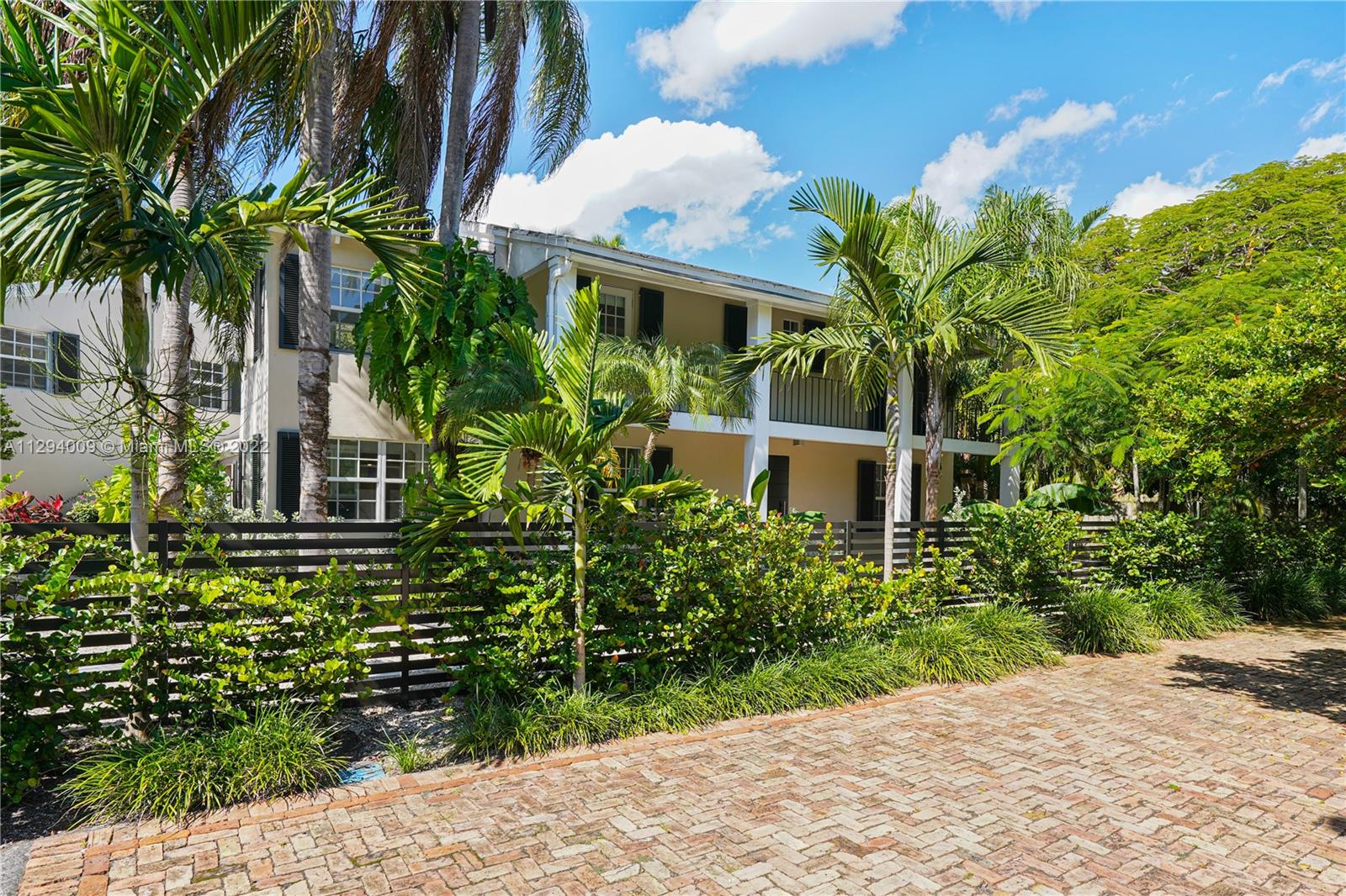 1701 Micanopy Avenue Miami, FL 33133 - Photo 2 of 46 a front view of a house with a yard