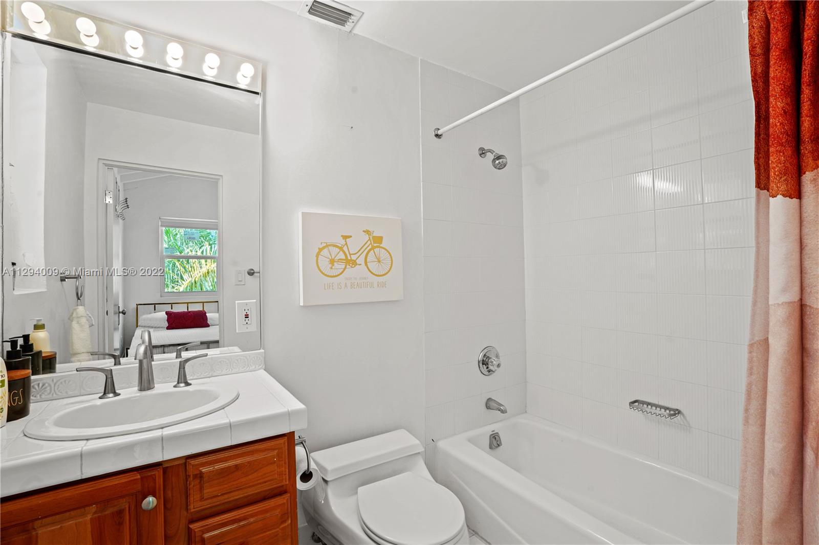 1701 Micanopy Avenue Miami, FL 33133 - Photo 28 of 46 a bathroom with a sink toilet and shower