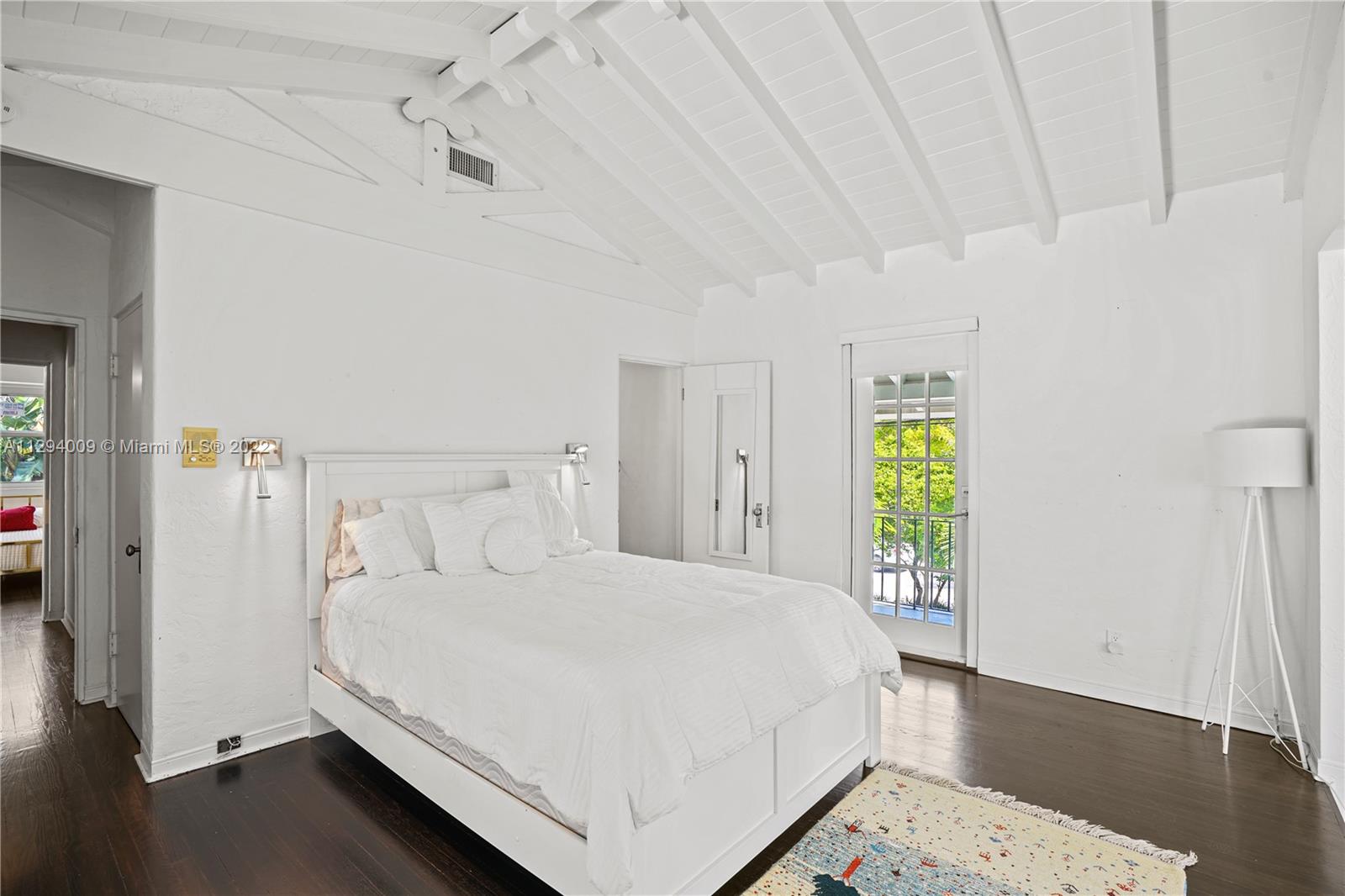 1701 Micanopy Avenue Miami, FL 33133 - Photo 31 of 46 a bedroom with a bed and a window